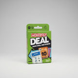 Monopoly Deal card game packaging on a gray background